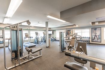 A Gym With Treadmills And Weights at Cadence at Griesbach, Alberta, T5E 1Y8