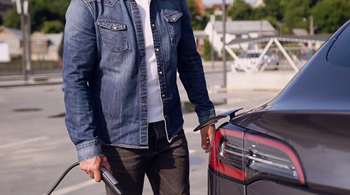 a man holding the trunk of a car