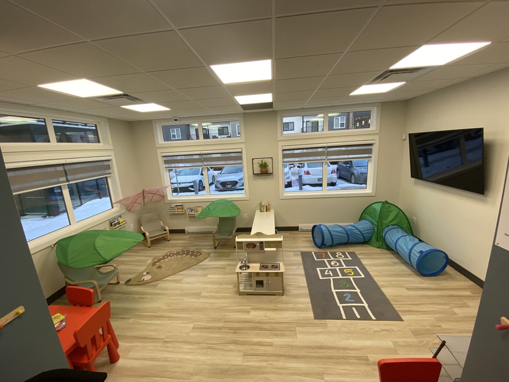 A room with a lot of toys for children to play with.