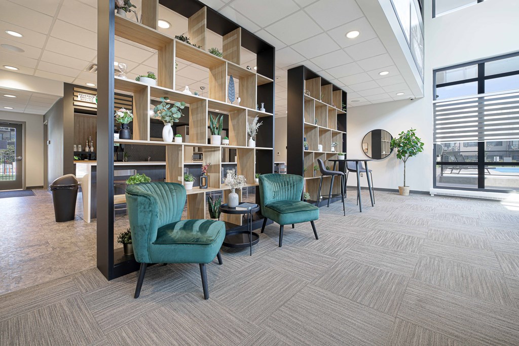 A room with a green chair and a wooden shelf.