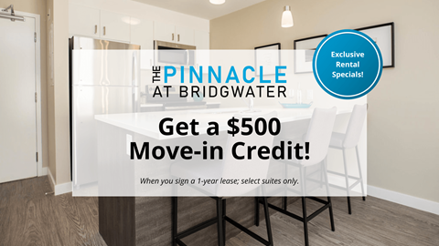 A room with a sign offering a $500 move-in credit for a 1-year rental at The Pinnacle at Bridgwater.