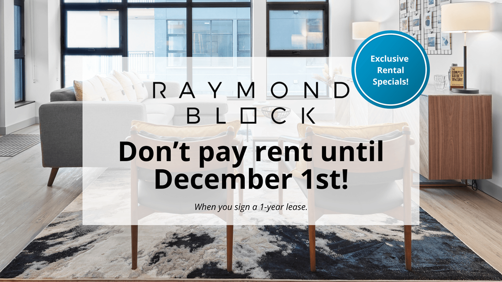 A room with a sign that says "RAYMOND BLOCK Don't pay rent until December 1st!".