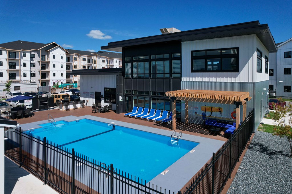 Exterior - wide shot of swimming pool and clubhouse