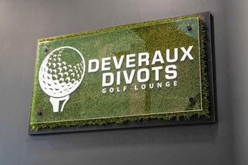 A sign for Deveraux Divots Golf Lounge at Skyway Apartments, Calgary, T3B 5V6