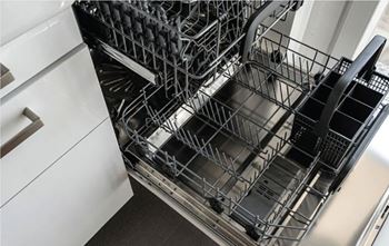 A dishwasher with its racks removed.