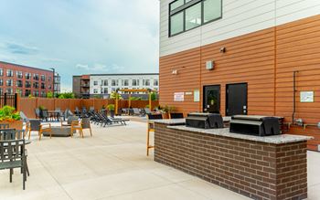 A patio area with a DJ booth and seating.