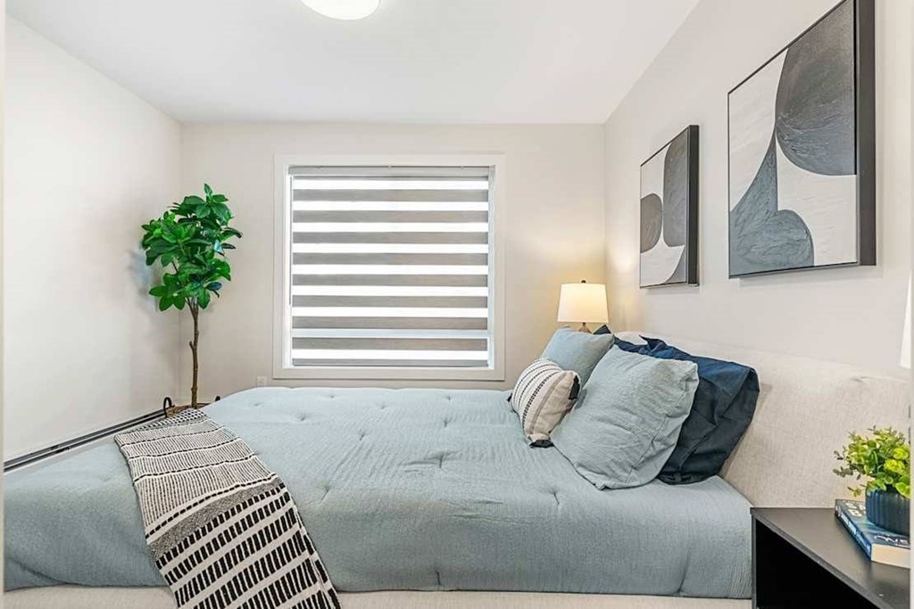Comfortable Bedroom at Skyway Apartments, Calgary, AB T3B 5V6
