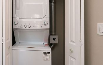 A white dishwasher with the label "enterprise" on it.