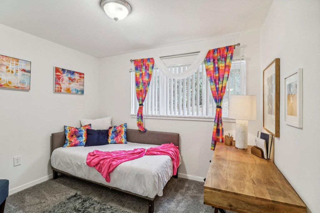 a bedroom with a bed and a window at Oaks at Oxon Hill, Oxon Hill, Maryland