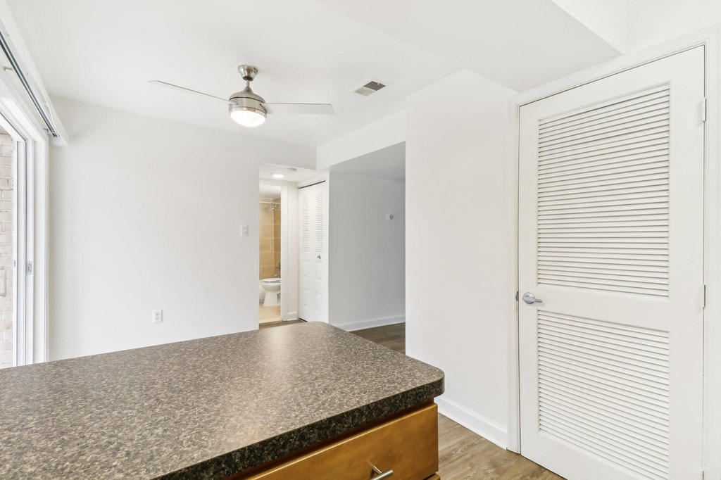 a kitchen with a counter top and a door to a hallway at Oaks at Oxon Hill, Oxon Hill, Maryland