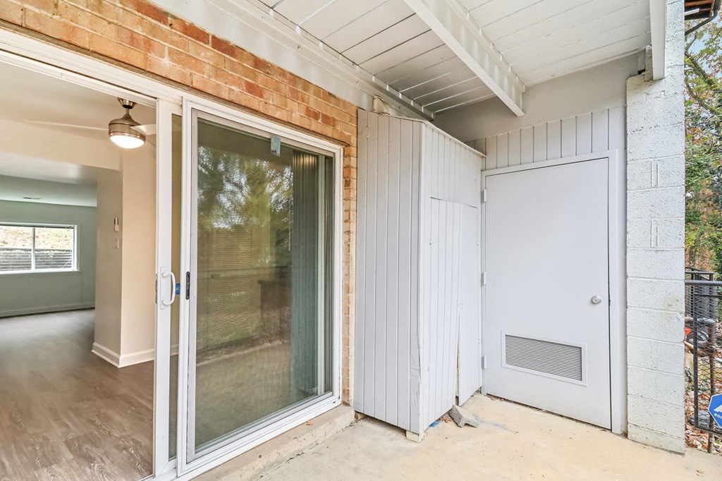 the entrance to a home with a white door and a sliding glass door at Oaks at Oxon Hill, Oxon Hill, Maryland