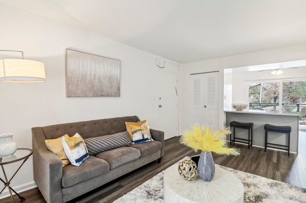 a living room with a couch and a table at Oaks at Oxon Hill, Oxon Hill, Maryland