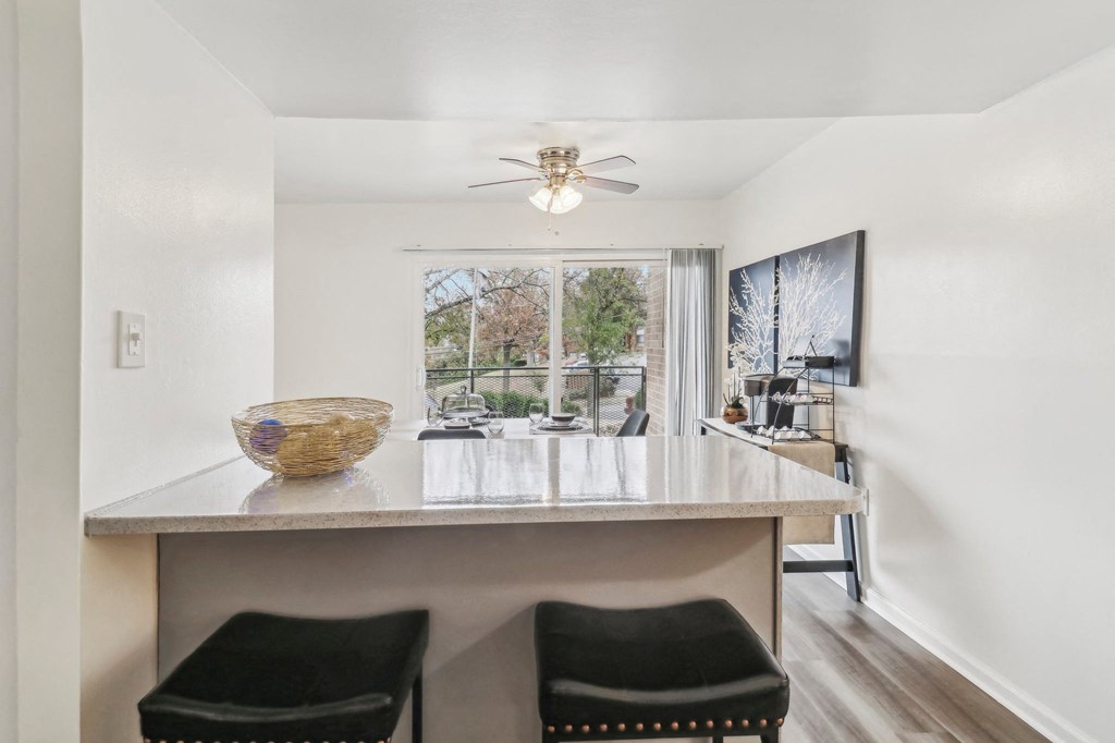 a kitchen with a counter top and a large window at Oaks at Oxon Hill, Oxon Hill, Maryland