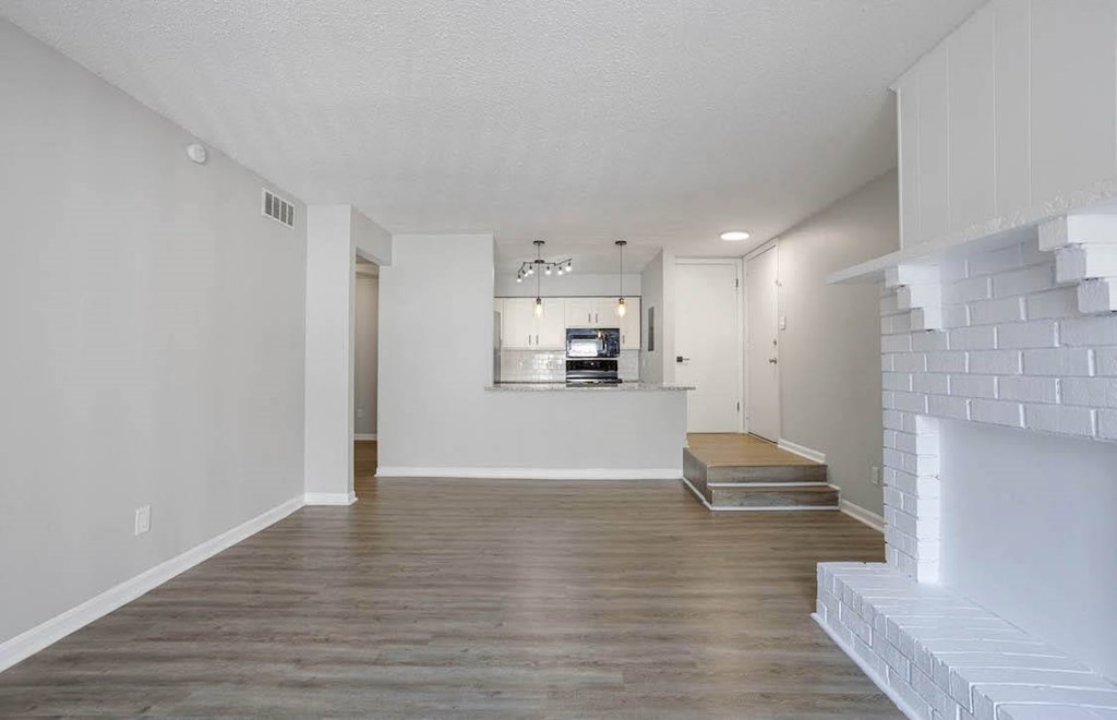 A modern living room with a fireplace and a flat screen TV. A modern living room with a fireplace and a flat screen TV at The Onyx Hoover Apartments, Hoover, Alabama