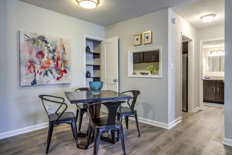A dining room with a table and chairs at The Onyx Hoover Apartments, Hoover, AL, 35216