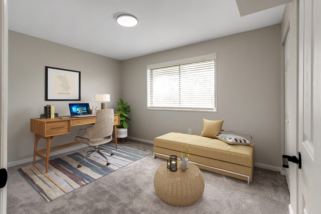 bedroom with couch and desk at Flats of Forestville, Forestville, Maryland 20747