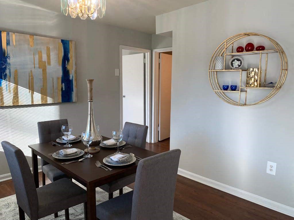 a dining room with a table and chairs at The Glendale Residence, Lanham, Maryland