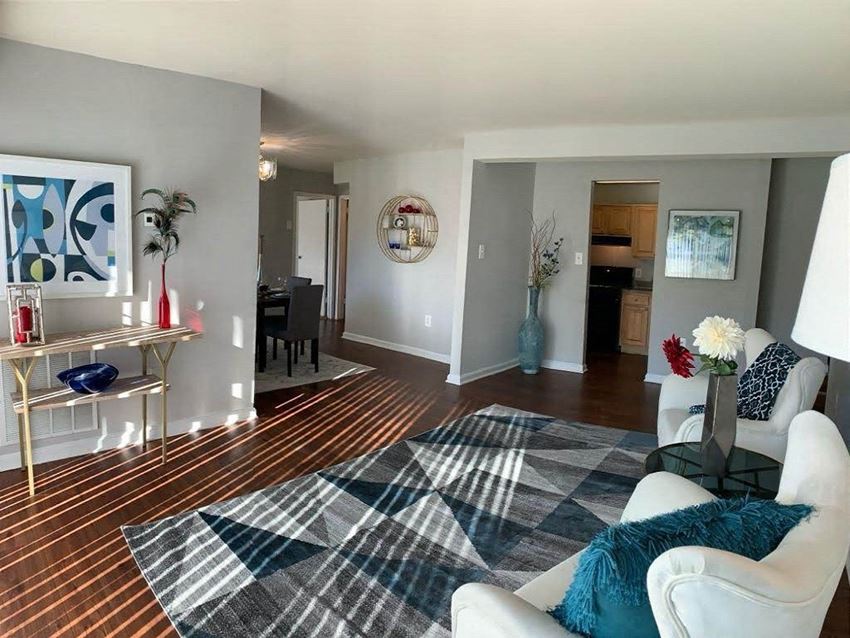 a living room with a couch and a chair - Photo Gallery