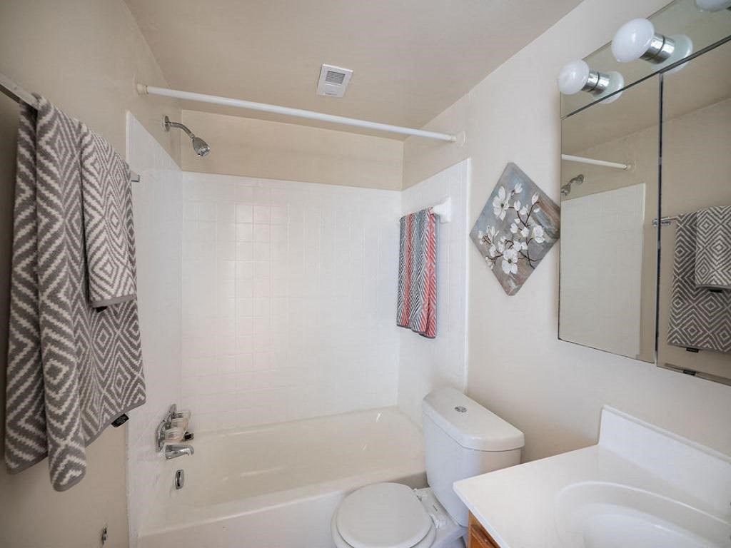a bathroom with a sink toilet and bathtub at The Glendale Residence, Maryland, 20706