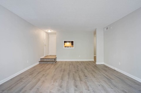 A room with light wood flooring and a white door at The Onyx Hoover Apartments, Hoover, 35216