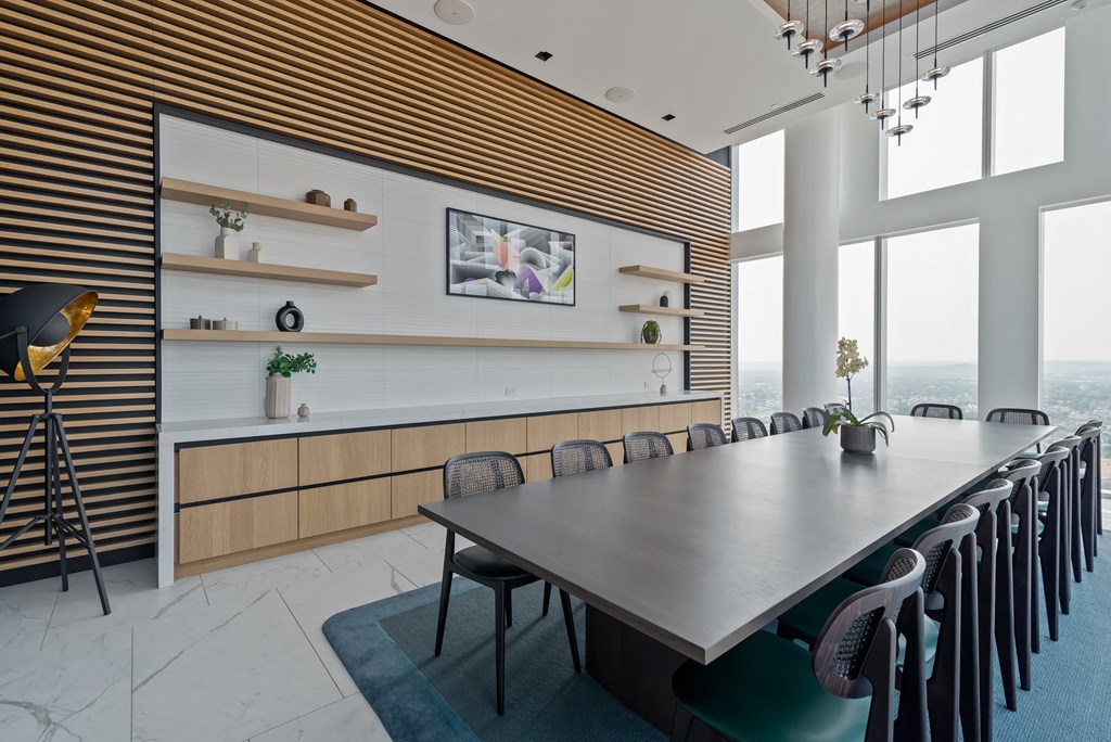 a conference room with a long table and chairs