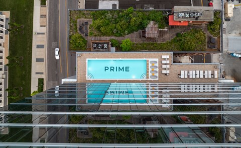 An aerial view of a swimming pool with the word "PRIME" written on it.