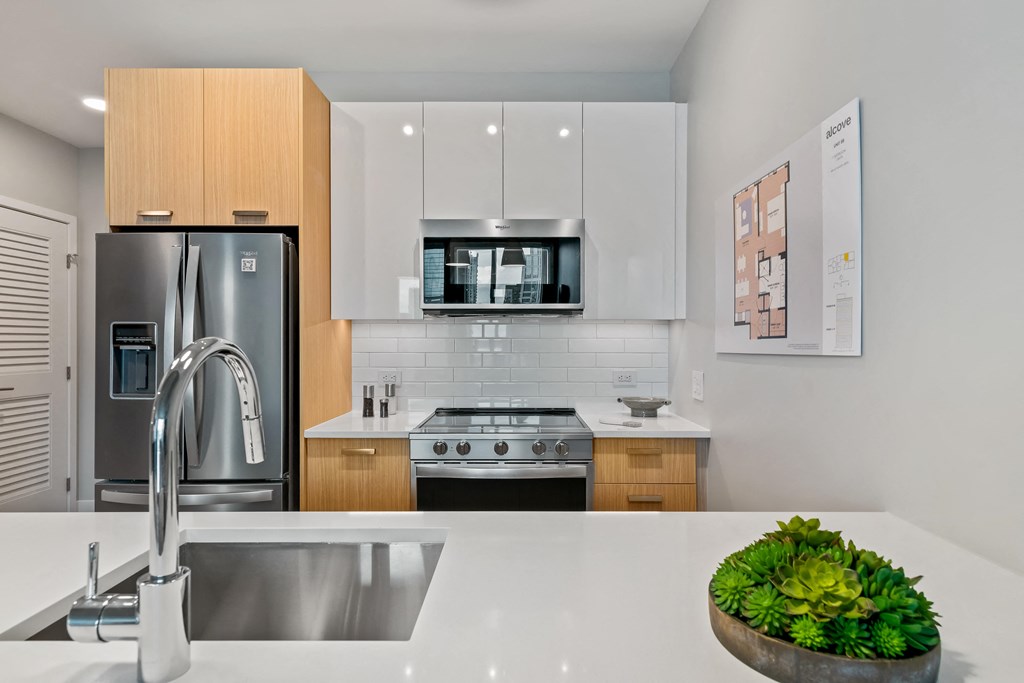a kitchen with a large island and a sink