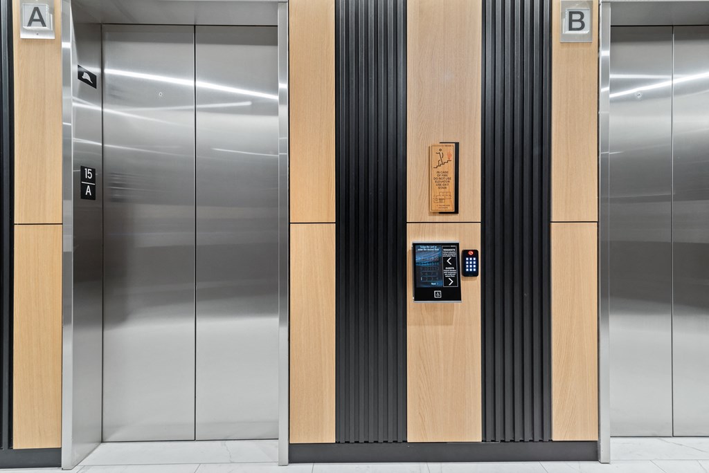 a row of elevators in an office building