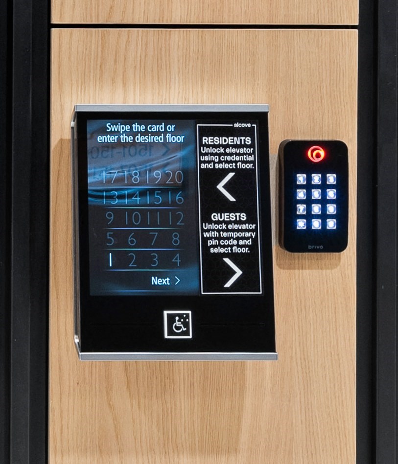 a clock on the wall next to a remote control