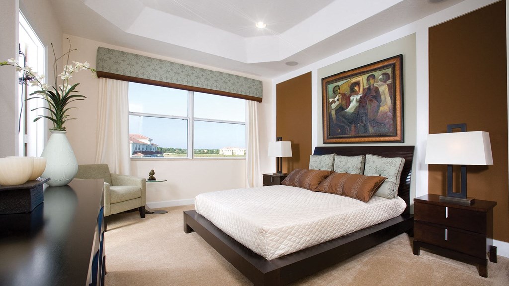 A bedroom with vaulted ceiling at The Falls of Portofino at The Falls of Portofino, Naples, FL