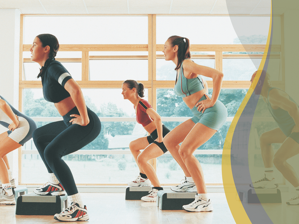 a group of women doing aerobic exercises in a gym