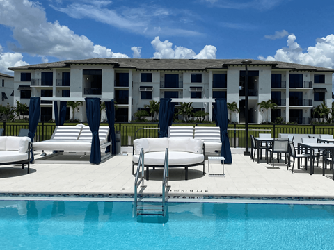 Pool With Relaxing Chairs at The Orchard at Portofino Vineyards, Fort Myers, FL