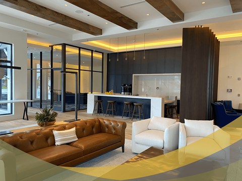 a living room with a couch and a kitchen