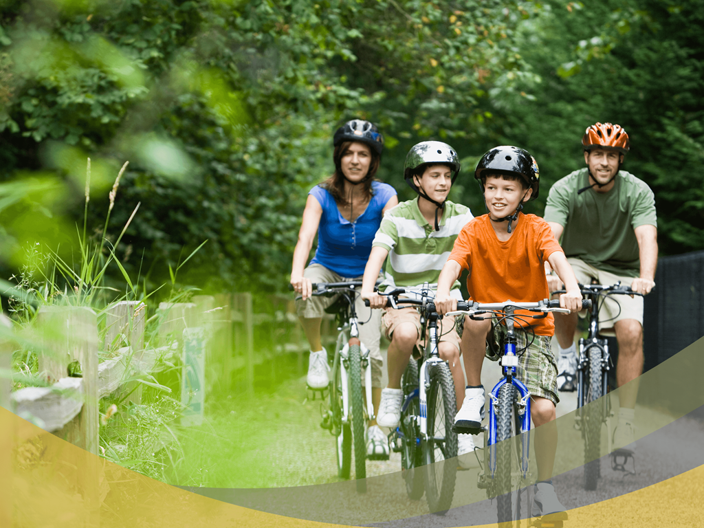 a group of people riding bikes on a trail