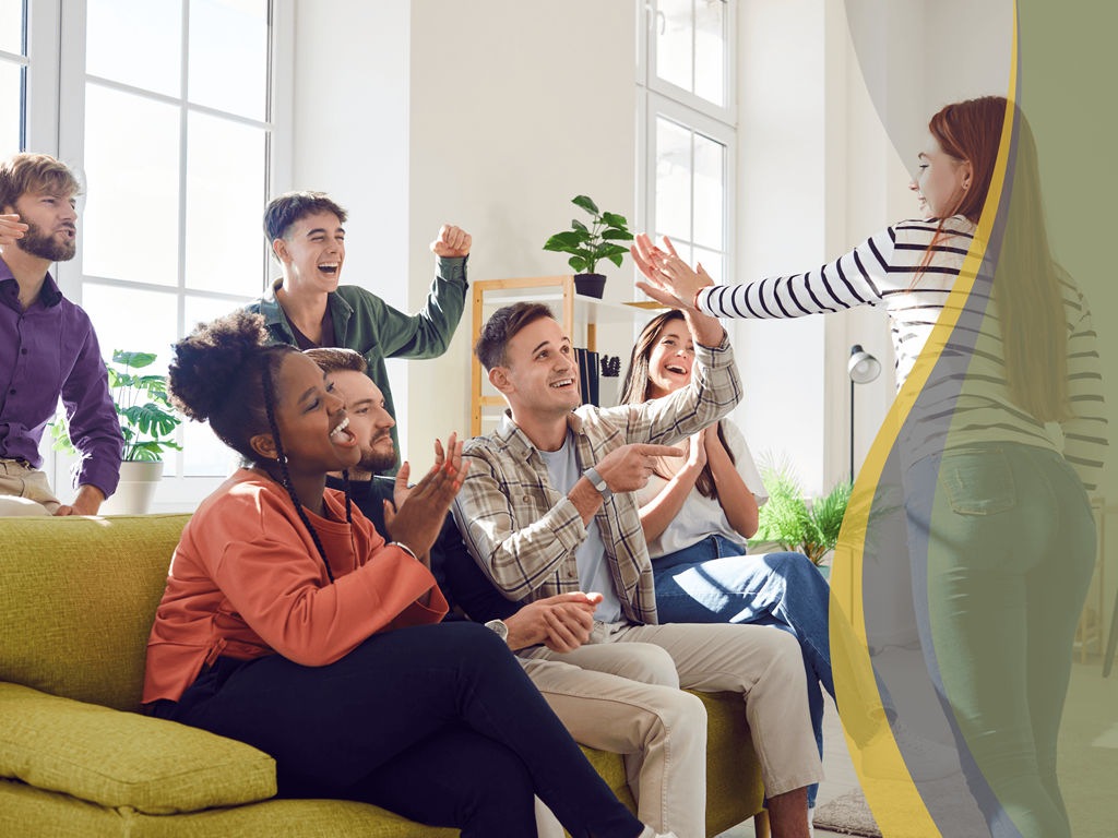 a group of people sitting in a living room playing with a slide