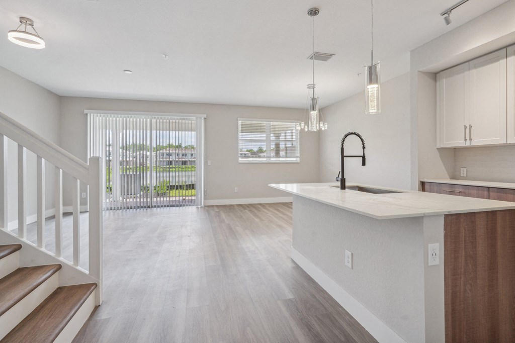 the living room and kitchen of a new home with an open floor plan