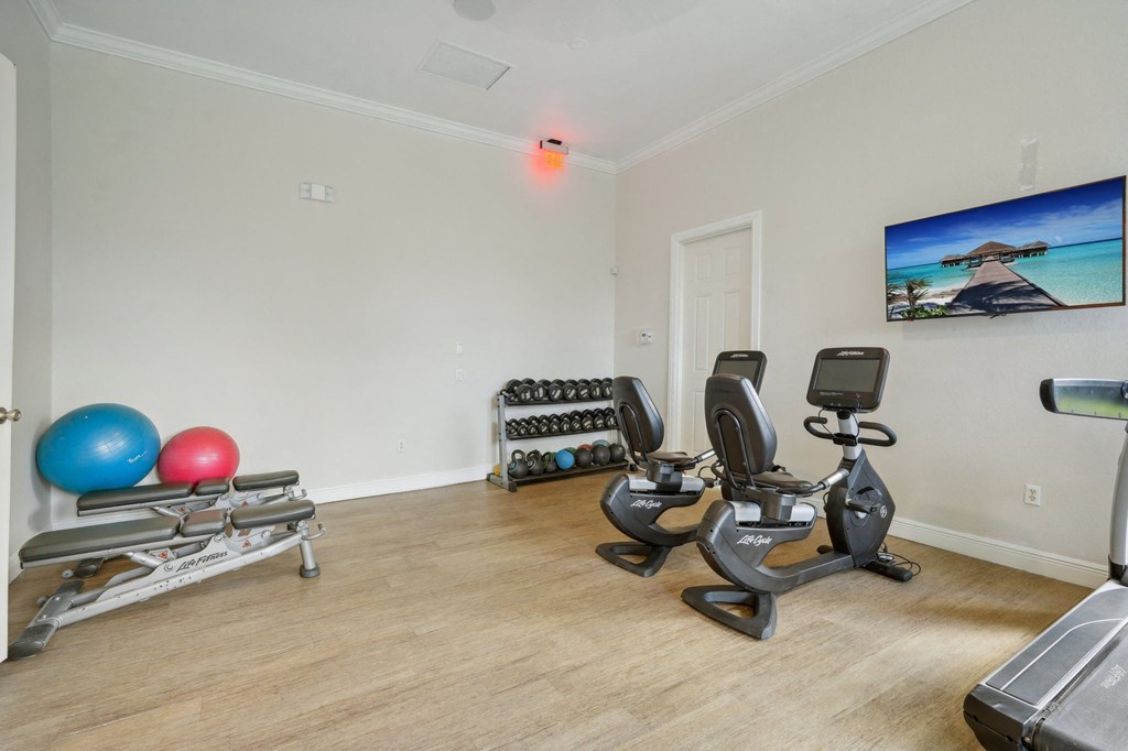 the gym at the district flats apartments in lenexa