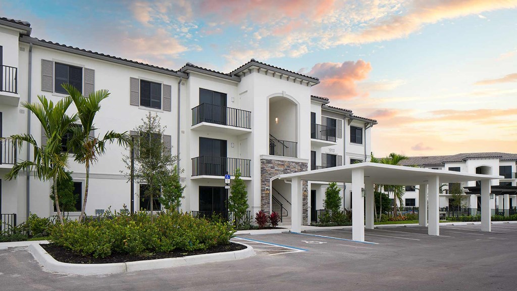 a rendering of the exterior of a building at sunset