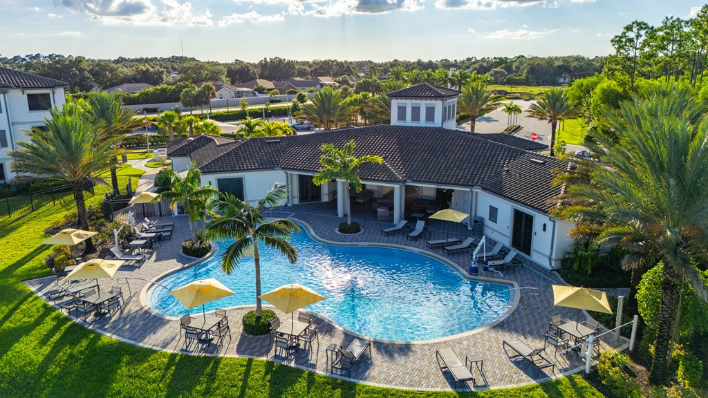 A large house with a pool in the backyard.