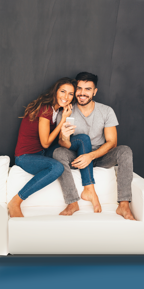 a couple sitting on a couch at The Orchard at Portofino Vineyards, Fort Myers, 32149