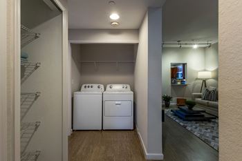 A laundry room with a washer and dryer.