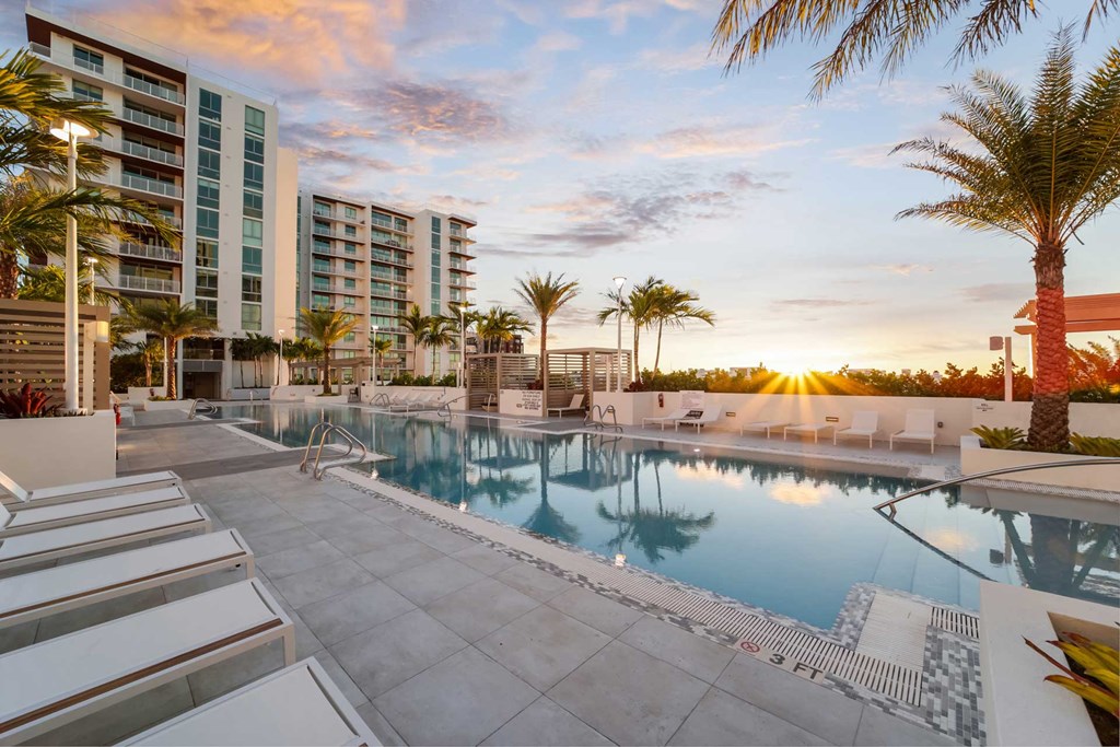 Sunset on The Bridge at Quantum Apartments palm lined pool deck