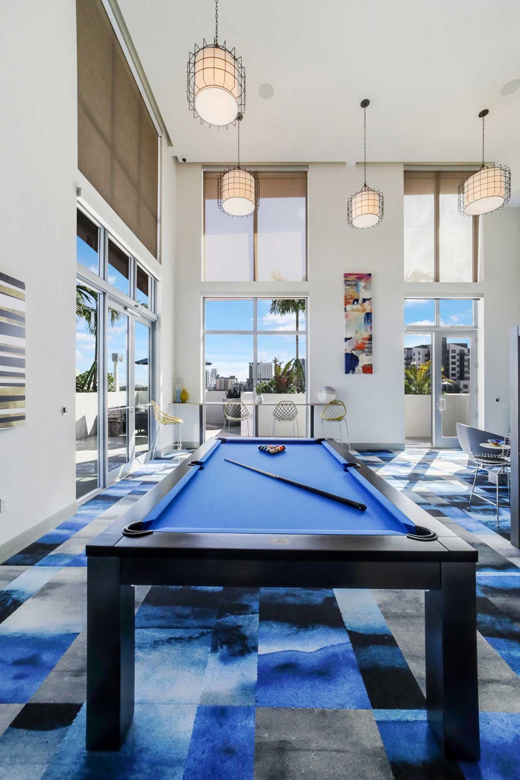 Interior of Quantum Clubhouse with billards table in the foreground.