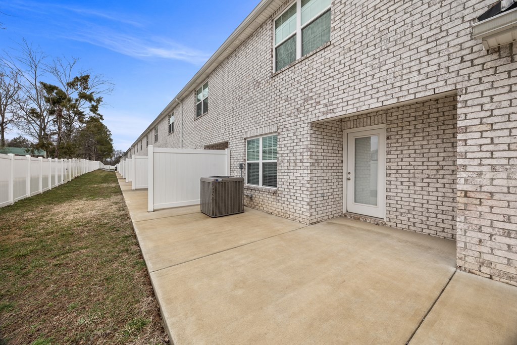 A brick house with a white garage door.