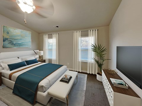 A bedroom with a large bed and a television.