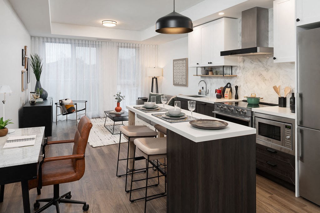 a kitchen with an island and a dining table