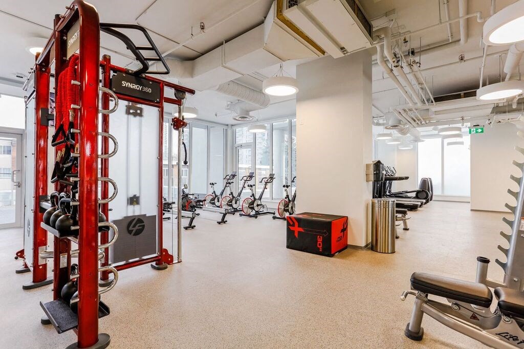 a gym with weights and other exercise equipment in a workspace