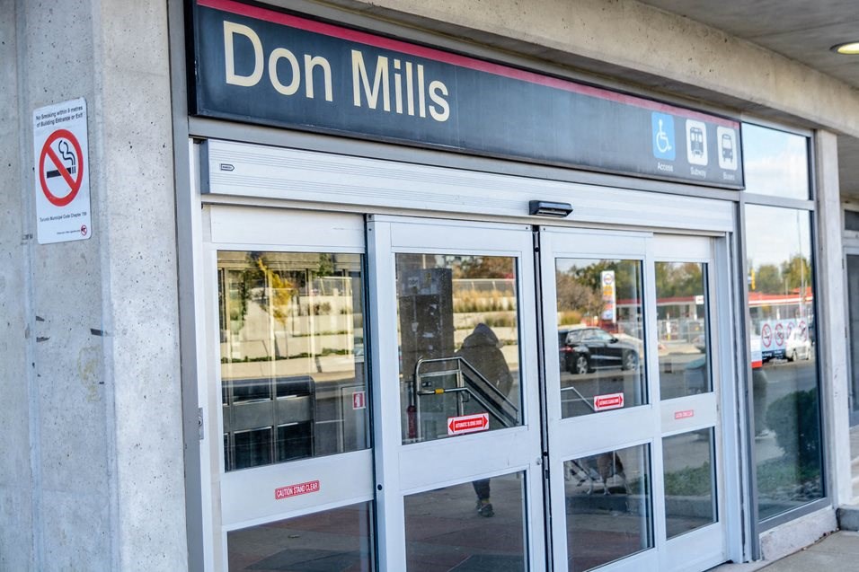 the front of a mills store with glass doors
