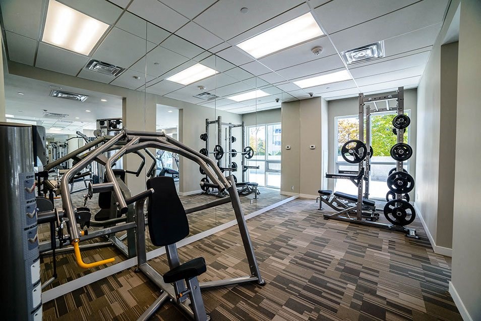 a gym with weights and other exercise equipment in a building