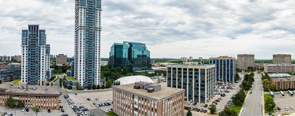 a cityscape of a city with tall buildings and cars